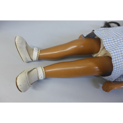 659 - A rare version 1960s Sasha doll with NP (no philtrum) with brown wig, Gingham dress, white leather s... 