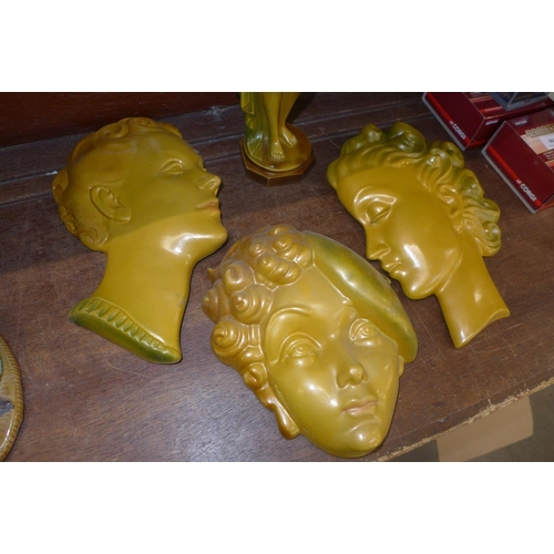 662 - Art Deco style ornamental items, three face masks and a nude figure