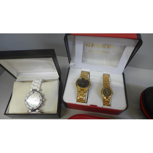 669 - A collection of watch cases including Tissot and Omega, and three wristwatches