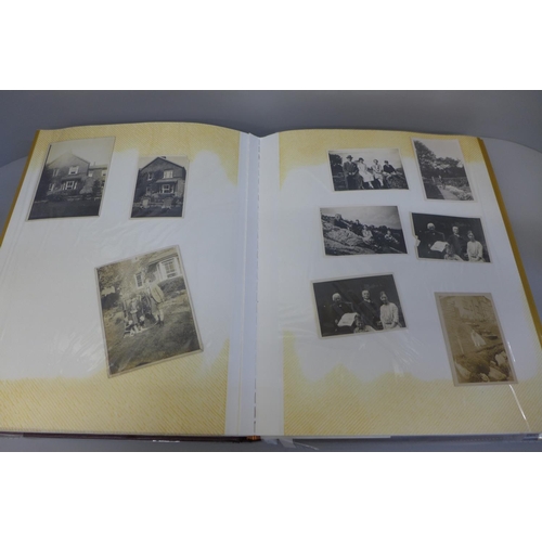 692 - An album of Edwardian and later black and white family photographs and some correspondence including... 