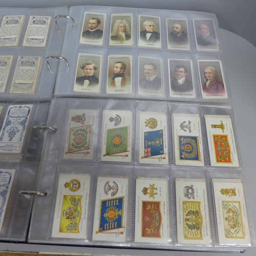 739 - Two albums of Wills and other cigarette cards; famous people, Army equipment, military honours with ... 