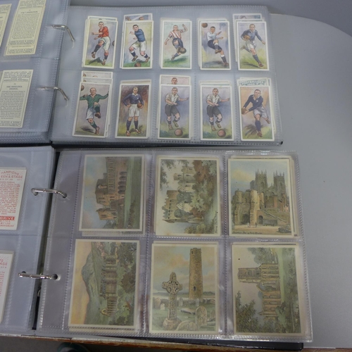 752 - Two albums of John Player cigarette cards; old footballers, old caricatures, etc.