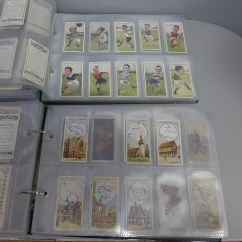 752 - Two albums of John Player cigarette cards; old footballers, old caricatures, etc.