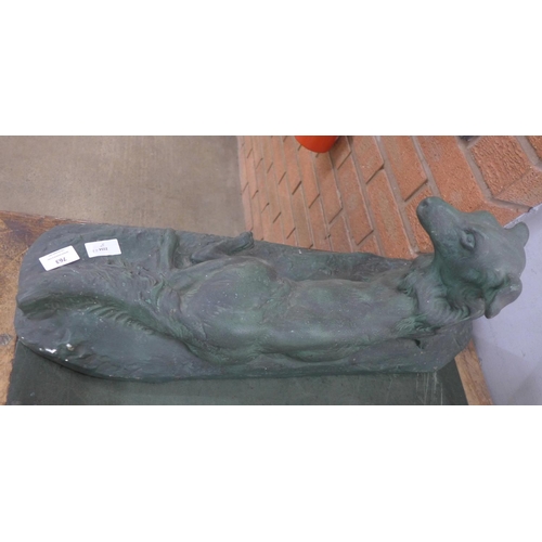 763 - A large Art Deco figure of a laying dog