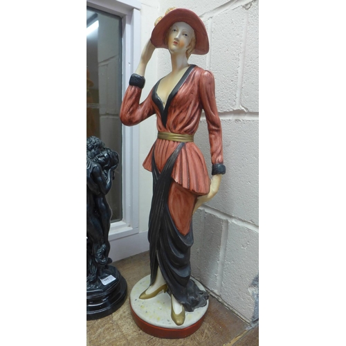 777 - A tall pottery figure of a 1920's lady and a resin figure of The Lovers