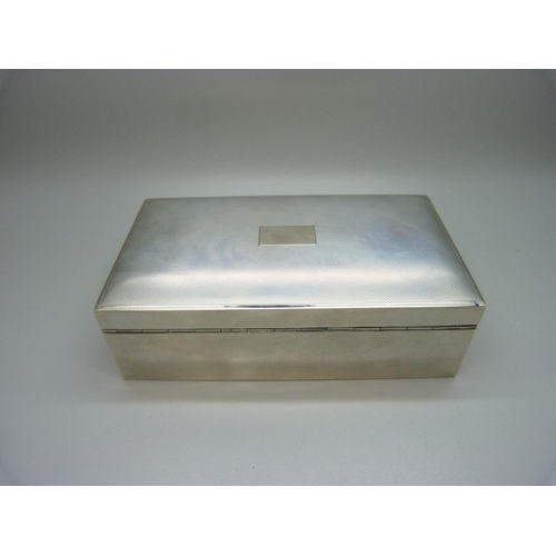 802 - An Art Deco style silver cigarette box with wood lining, 518g gross