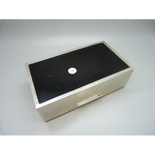 802 - An Art Deco style silver cigarette box with wood lining, 518g gross