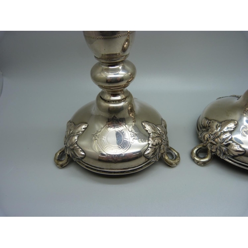 815 - A pair of continental silver candlesticks, marked 750, 270g