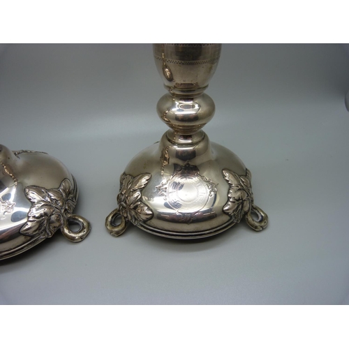 815 - A pair of continental silver candlesticks, marked 750, 270g