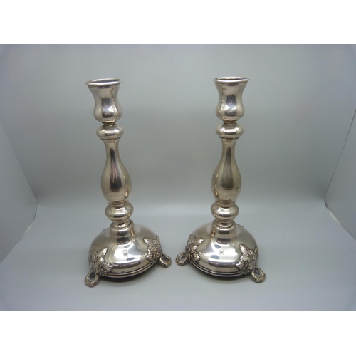 815 - A pair of continental silver candlesticks, marked 750, 270g