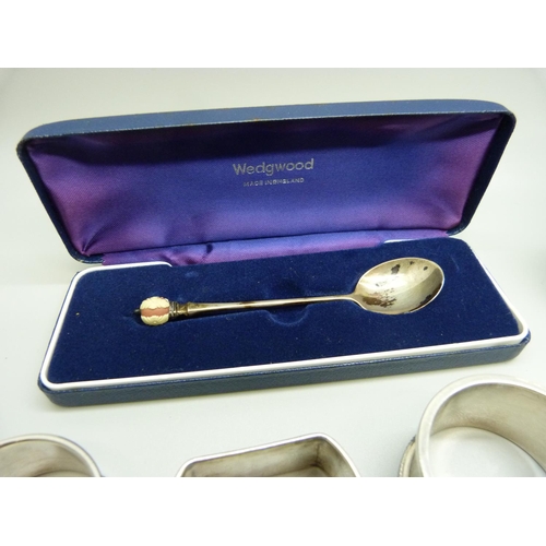 818 - A collection of silver items; oval photograph frame, a pair of Georgian mustard spoons, three napkin... 