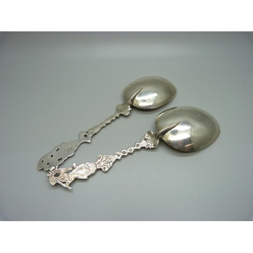 819 - Two similar cast silver Scandinavian serving spoons, 134g