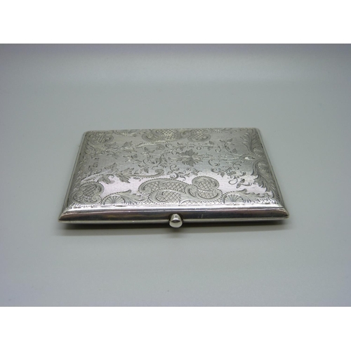 821 - A silver card case, with engine turned and engraved foliate decoration, Birmingham 1901, leather lin... 