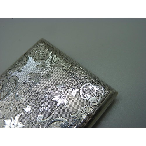 821 - A silver card case, with engine turned and engraved foliate decoration, Birmingham 1901, leather lin... 