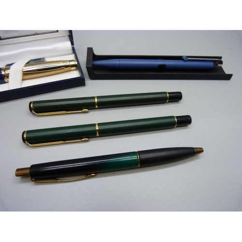 831 - A Ronson pen, three ballpoint pens and a fountain pen