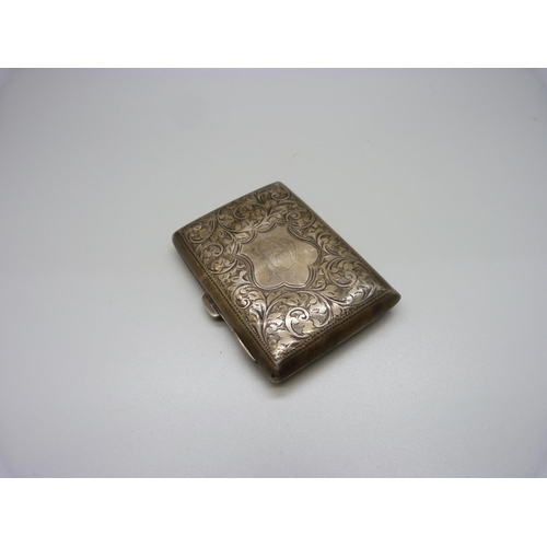 843 - A silver cigarette case, with engraved decoration, initials to the centre, 63g