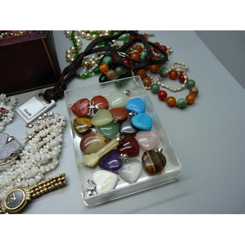 852 - Costume jewellery and gemstone pendants in a vintage jewellery box