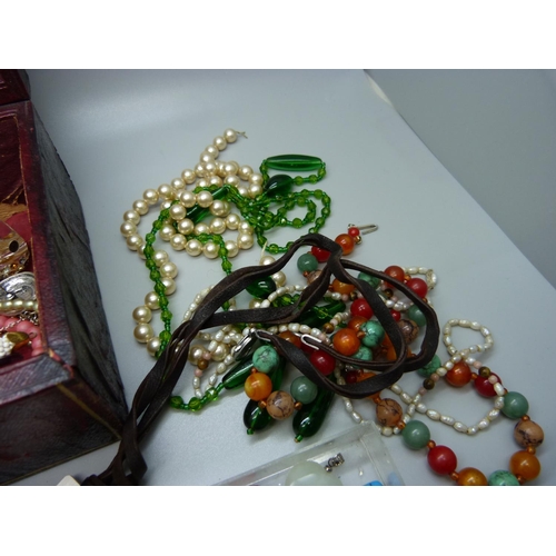 852 - Costume jewellery and gemstone pendants in a vintage jewellery box