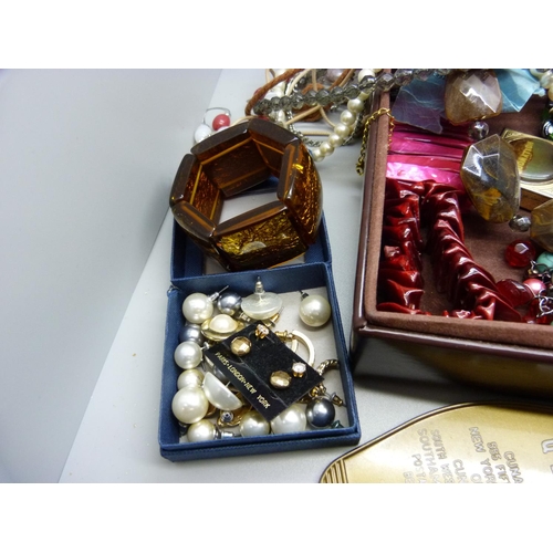 863 - A box of costume jewellery, cufflinks and a Hollywood pill box, plus three gemstones, ruby, sapphire... 