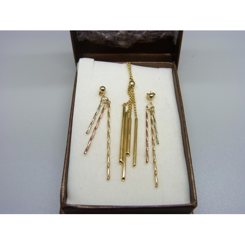 868 - A 9ct gold pendant and chain and a pair of similar earrings, 4.7g