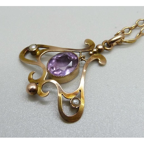 869 - A vintage Art Nouveau 9ct gold, amethyst and seed pearl pendant and chain, 6.7g