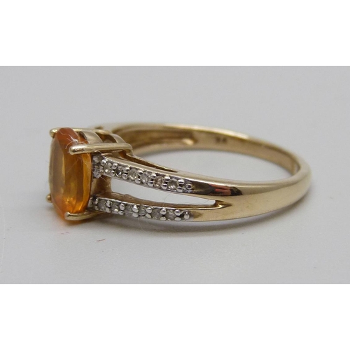 874 - A 9ct gold, fire opal and diamond ring, 2.8g, P