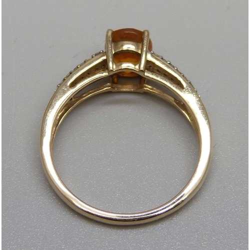 874 - A 9ct gold, fire opal and diamond ring, 2.8g, P