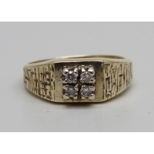 879 - A 9ct gold, four stone diamond set ring, 2.9g, M