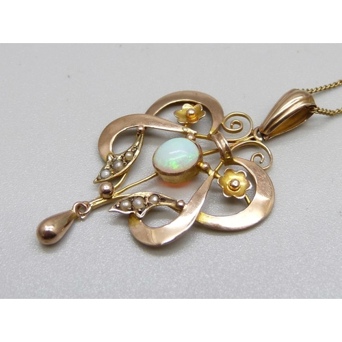 882 - A vintage Art Nouveau 9ct gold and opal pendant and chain, 4.0g