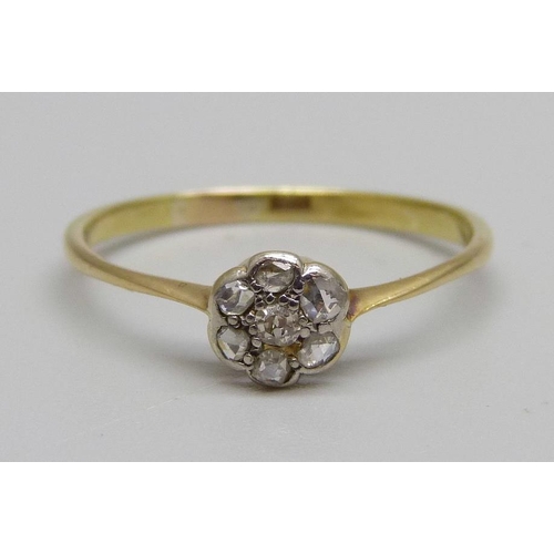 890 - A 1920's 18ct gold and diamond cluster ring, 1.6g, R