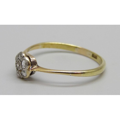 890 - A 1920's 18ct gold and diamond cluster ring, 1.6g, R