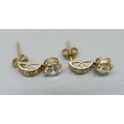 891 - A pair of 9ct gold and diamond ear studs, approximately 1.15ct diamond weight