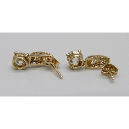 891 - A pair of 9ct gold and diamond ear studs, approximately 1.15ct diamond weight