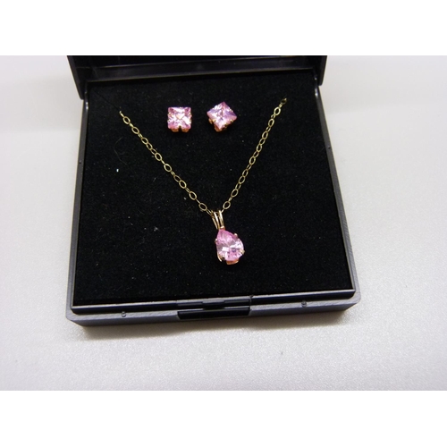 892 - A 9ct gold and pink stone pendant and chain with matching earrings