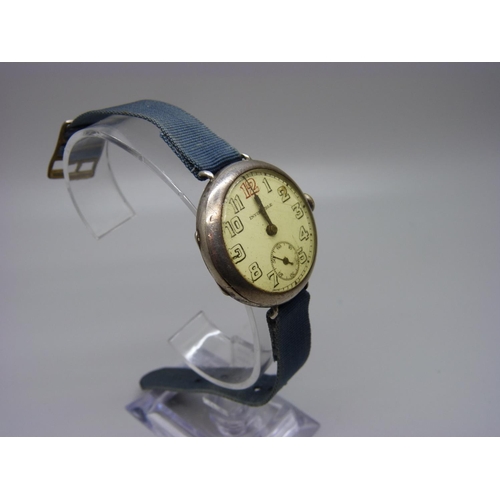 897 - A silver trench watch marked Invincible, London import mark, 1926