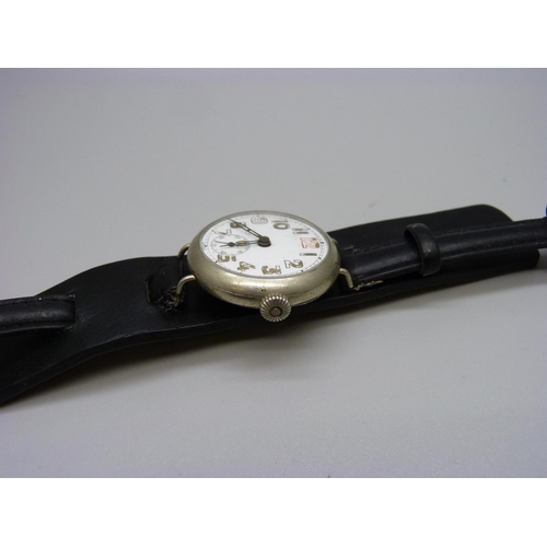 900 - A WWI trench watch with engraving on case back 'Presented to M Leach, from the Scout Munition Worker... 