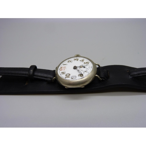 900 - A WWI trench watch with engraving on case back 'Presented to M Leach, from the Scout Munition Worker... 