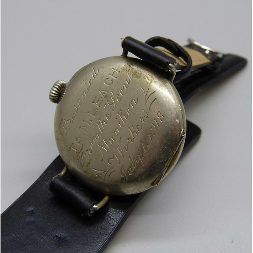 900 - A WWI trench watch with engraving on case back 'Presented to M Leach, from the Scout Munition Worker... 