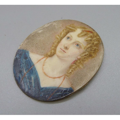 908 - A 19th Century oval watercolour miniature of a young lady