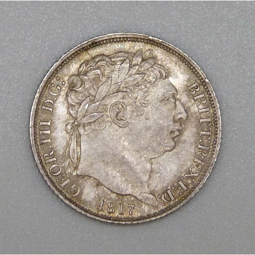 910 - A George III 1817 bull-head sixpence