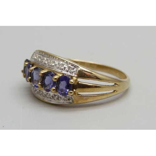 925 - A 9ct gold, fourteen stone diamond and tanzanite ring, 2.4g, P