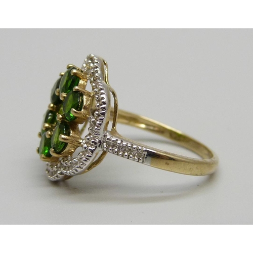 929 - A 9ct gold, green diopside and thirty-eight stone diamond ring, 3.8g, P