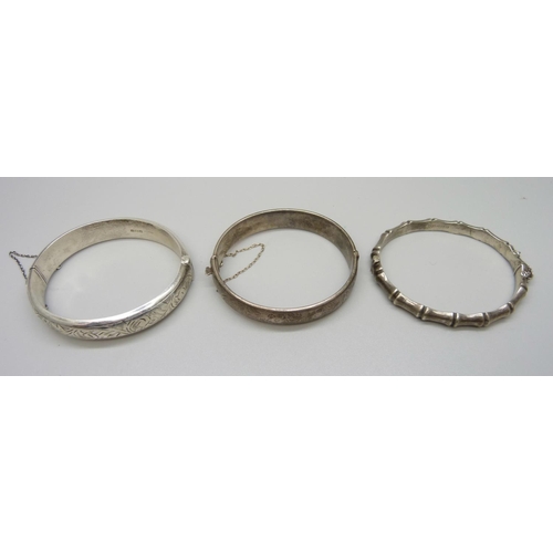 935 - Three silver bangles, 55g