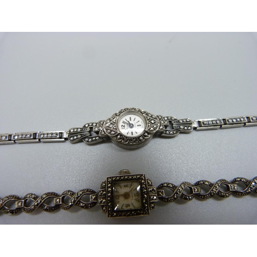 943 - Three lady's silver and marcasite wristwatches, one unmarked but tests as silver, winder missing on ... 