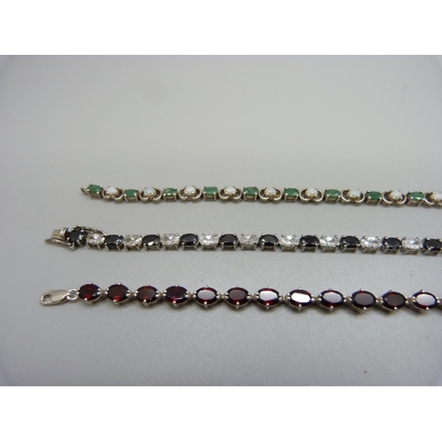 960 - Three silver gem set tennis bracelets, emerald/opal, garnet, etc., 32g