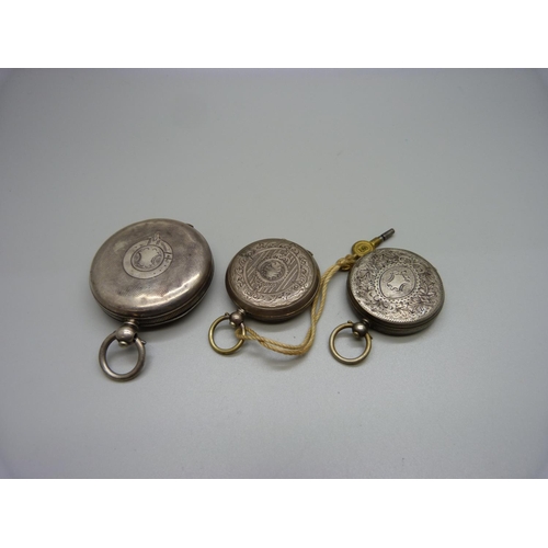 976 - A silver pocket watch and two silver fob watches, one lacking glass