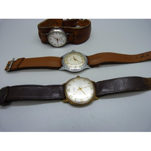 980 - Three wristwatches; Uno, Avia and silver trench watch