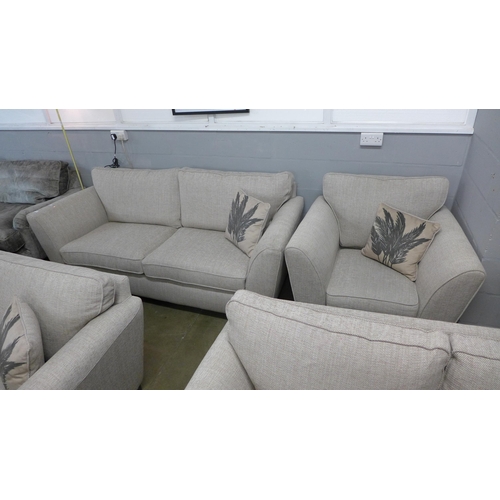 1346 - An oatmeal upholstered three seater sofa and armchair - RRP £1898