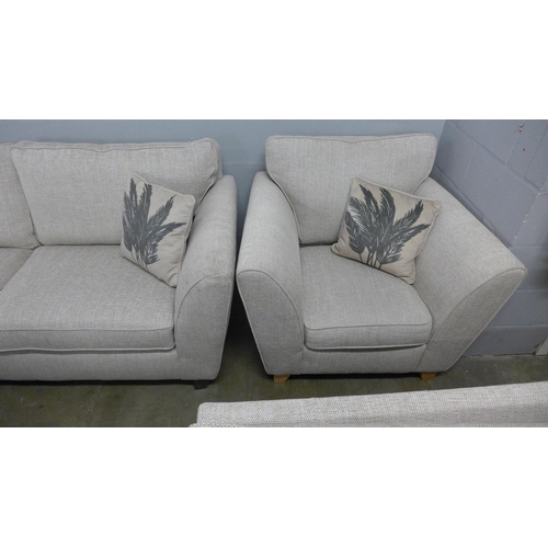 1346 - An oatmeal upholstered three seater sofa and armchair - RRP £1898