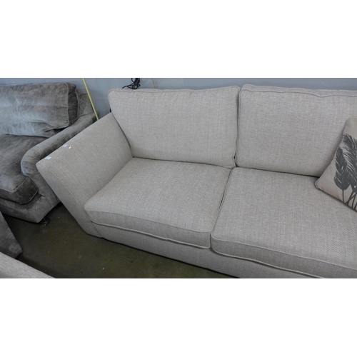 1346 - An oatmeal upholstered three seater sofa and armchair - RRP £1898